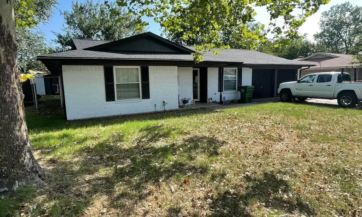 Professional roofing crew working on a residential roof in Norwich